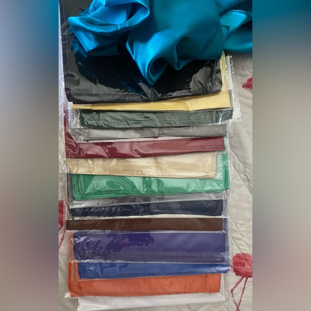 Lot of beautiful satin scarves.